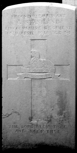 Grave stone of Geoffrey Staniland reading "Second Lieutenant G Staniland, Lincolnshire Regiment, 13th April 1915, age 34. The Lord bless thee and keep thee."